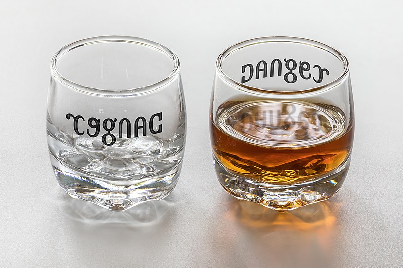 https://commons.wikimedia.org/wiki/File:Ambigram_Cognac_Danger_on_a_set_of_two_shot_glasses_(empty_and_full).jpg